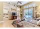 Spacious living room with neutral decor, flows to screened patio and pool view at 9406 Burnam Dr, Weeki Wachee, FL 34613
