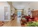 Bright living room featuring a sliding glass door leading to the pool and stylish decor at 9406 Burnam Dr, Weeki Wachee, FL 34613