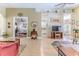 Open living room with neutral tones and entryways to the office and kitchen at 9406 Burnam Dr, Weeki Wachee, FL 34613