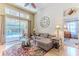 Inviting living room with a large sliding glass door that leads to a private pool area at 9406 Burnam Dr, Weeki Wachee, FL 34613