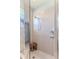 Shower features white tile, glass block window, and soap and shampoo niche at 9406 Burnam Dr, Weeki Wachee, FL 34613