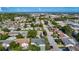 An aerial view of a residential neighborhood with tree-lined streets and proximity to the coast at 9425 Sterling Ln, Port Richey, FL 34668