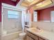 Functional bathroom featuring a tub, vanity, and mirrored cabinet for storage at 9425 Sterling Ln, Port Richey, FL 34668
