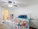 Bright bedroom with floral bedding and natural light, showcasing comfort at 9425 Sterling Ln, Port Richey, FL 34668