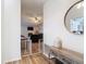 Open entryway with wood-look floors, leading to a cozy living room and dining area at 9425 Sterling Ln, Port Richey, FL 34668