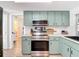 Well-lit kitchen featuring modern appliances and ample counter space at 9425 Sterling Ln, Port Richey, FL 34668