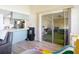 Bright living area featuring natural light and access to the adjacent kitchen at 9425 Sterling Ln, Port Richey, FL 34668