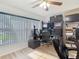 Bright office features a ceiling fan and a large window offering lots of natural light at 9425 Sterling Ln, Port Richey, FL 34668