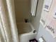 Bathroom featuring tub, and neutral tiles at 9474 Nakoma Way # E, Weeki Wachee, FL 34613