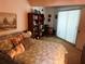 Bedroom featuring a bed, shelving, and natural light at 9474 Nakoma Way # E, Weeki Wachee, FL 34613