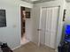 Neutral bedroom with a closet, and a view into another room at 9474 Nakoma Way # E, Weeki Wachee, FL 34613