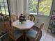 Breakfast nook featuring a table, chairs and natural light at 9474 Nakoma Way # E, Weeki Wachee, FL 34613