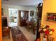 Traditional dining room with a wooden table, china cabinet, rug, and a glimpse into the kitchen at 9474 Nakoma Way # E, Weeki Wachee, FL 34613
