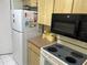 Kitchen featuring appliances and countertops at 9474 Nakoma Way # E, Weeki Wachee, FL 34613