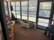 Sunroom featuring large windows that provides great outdoor views at 9474 Nakoma Way # E, Weeki Wachee, FL 34613