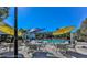 Community pool with tables and seating for relaxing in the sun at 9474 Nakoma Way # E, Weeki Wachee, FL 34613
