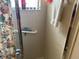 Shower with tiled walls, grab bar, and shower curtain at 9474 Nakoma Way # E, Weeki Wachee, FL 34613