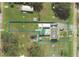 Aerial view of the home's layout showing the building footprint, outbuildings and property boundaries at 10654 Holgate St, New Port Richey, FL 34654