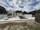 Fenced backyard with covered patio area and shed at 10654 Holgate St, New Port Richey, FL 34654