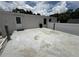A view of the backyard concrete patio from the house at 10654 Holgate St, New Port Richey, FL 34654