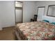 Inviting bedroom boasts a large bed, closet access, and natural light from a window at 10654 Holgate St, New Port Richey, FL 34654