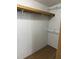 Spacious closet has a shelf and rod for organized storage of clothing and accessories at 10654 Holgate St, New Port Richey, FL 34654