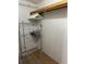 Organized closet features wire shelving and hanging rods, providing ample storage space at 10654 Holgate St, New Port Richey, FL 34654