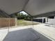 This large covered patio area looks out onto the backyard at 10654 Holgate St, New Port Richey, FL 34654