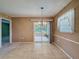 Dining room with tile floor and sliding glass door to the lanai at 11094 Auburndale St, Spring Hill, FL 34609