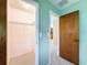 Hallway with closet and views of the kitchen at 11094 Auburndale St, Spring Hill, FL 34609