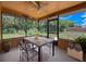 Relaxing screened lanai with ceiling fan and outdoor views at 11094 Auburndale St, Spring Hill, FL 34609