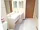 A functional bathroom with a single sink vanity and wall mirror at 11263 Murraysville Dr, Spring Hill, FL 34609