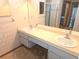 Bathroom with a double sink vanity and a walk-in shower at 11263 Murraysville Dr, Spring Hill, FL 34609
