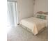 Bedroom with neutral carpet, soft lighting, and vertical blinds on the window at 11263 Murraysville Dr, Spring Hill, FL 34609
