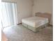 Bedroom featuring a queen size bed and sliding glass doors at 11263 Murraysville Dr, Spring Hill, FL 34609