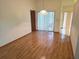 Hardwood dining room featuring hanging light fixture and sliding glass door at 11263 Murraysville Dr, Spring Hill, FL 34609