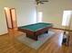Spacious game room with a pool table and wood flooring at 11263 Murraysville Dr, Spring Hill, FL 34609