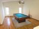 Recreation room with pool table, ceiling fan and ample space for entertainment and relaxation at 11263 Murraysville Dr, Spring Hill, FL 34609