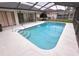 Enjoy the beautiful pool enclosed within a screened lanai, offering relaxation and recreation at 11263 Murraysville Dr, Spring Hill, FL 34609