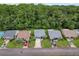 An aerial view showcases a neighborhood with well-maintained homes and lush greenery at 11622 White Ash Dr, New Port Richey, FL 34654
