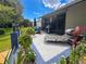 Backyard featuring a patio with lounge furniture, dining set, and landscaping at 11622 White Ash Dr, New Port Richey, FL 34654