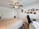 Bright bedroom featuring white walls, wood flooring, and built-in closet space for optimal storage at 11622 White Ash Dr, New Port Richey, FL 34654