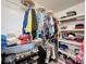 Walk-in closet featuring ample shelving, hanging storage, and organization at 11622 White Ash Dr, New Port Richey, FL 34654