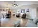 Expansive living room with stylish furniture, vaulted ceilings, and an open floor plan for seamless entertaining at 11622 White Ash Dr, New Port Richey, FL 34654