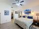 Main bedroom with wood floors, large closet, artwork, and side tables at 11622 White Ash Dr, New Port Richey, FL 34654