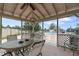 Relaxing pool area with seating and shade, perfect for enjoying sunny days in a community at 11725 Spring Tree Ln, Port Richey, FL 34668