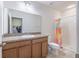 The bathroom has a shower and a vanity with granite countertops for a clean, modern feel at 12119 Barnsley Reserve Pl, Gibsonton, FL 33534