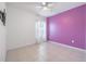 This bedroom has tile flooring, a ceiling fan, and a statement-colored wall at 12119 Barnsley Reserve Pl, Gibsonton, FL 33534