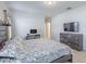 The main bedroom has tile flooring, a ceiling fan, and a matching dresser and nightstand at 12119 Barnsley Reserve Pl, Gibsonton, FL 33534