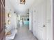 Bright entryway featuring tile floors, coat closet, and charming decor at 12119 Barnsley Reserve Pl, Gibsonton, FL 33534